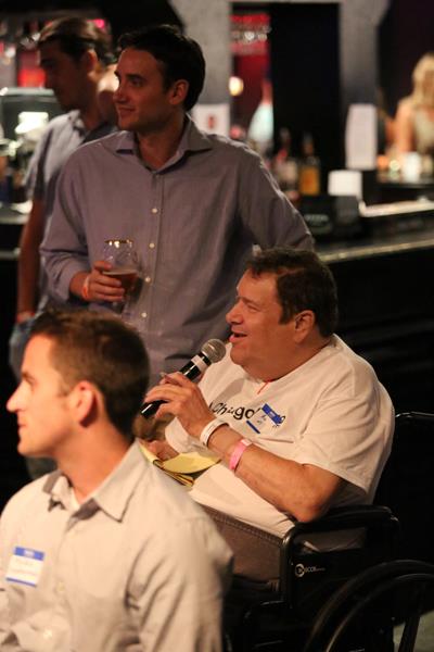 Ron May asks a question to Logan LaHive at Tech Cocktail Sessions in Chicago