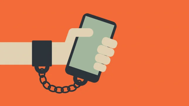 Phone chained to hand orange background iOS 12 Screen Time
