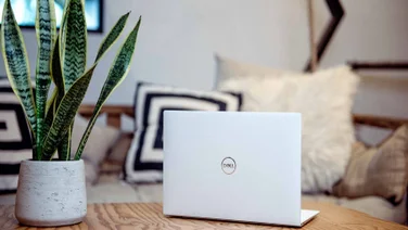 dell xps laptop on coffee table
