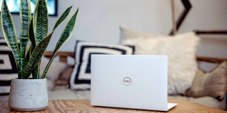 dell xps laptop on coffee table