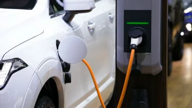 Electric Car Plugged in Charging
