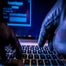 Hacker typing on keyboard