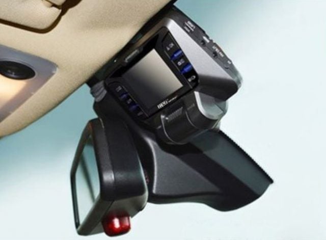 The REXING S300 dash cam, mounted in a vehicle