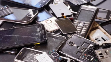 piles of phones in landfill