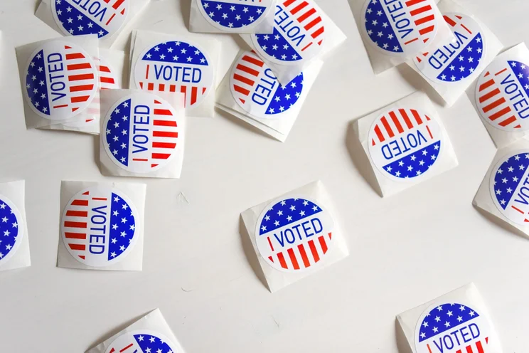 election stickers on a table
