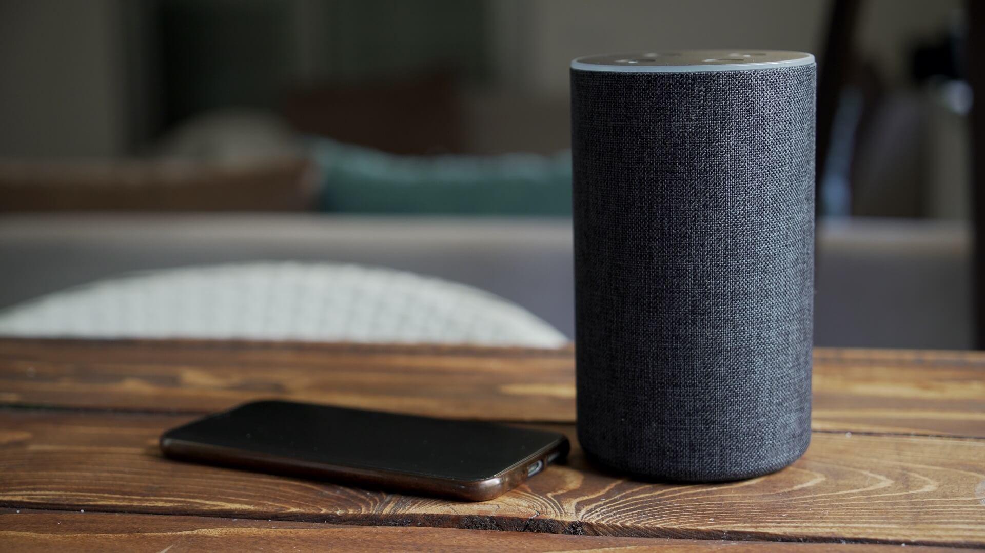 Amazon Alexa on a table with phone