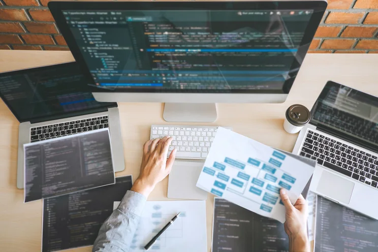 Person coding at a desk
