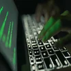 Man Typing on Laptop