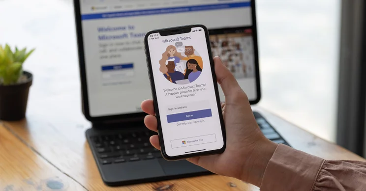 Image of Microsoft Teams app on smartphone and laptop