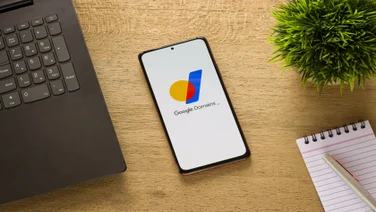 Google Domains logo on phone screen