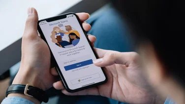 Close up image of a man signing into Microsoft Teams