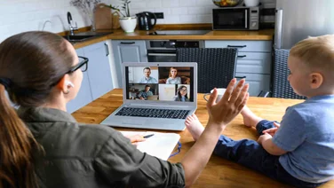 Woman Working from Home with Baby