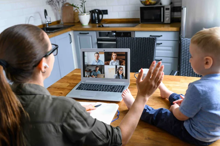 Woman Working from Home with Baby