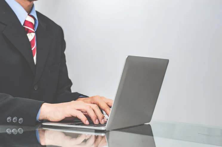 Man in suit working from home
