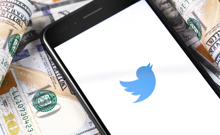 Twitter logo on U.S. dollars