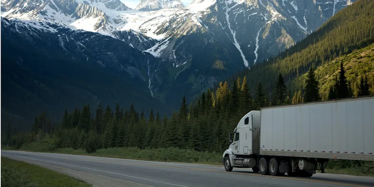 trucker in a business fleet delivering to mountainous area