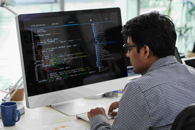 Man at desk with computer