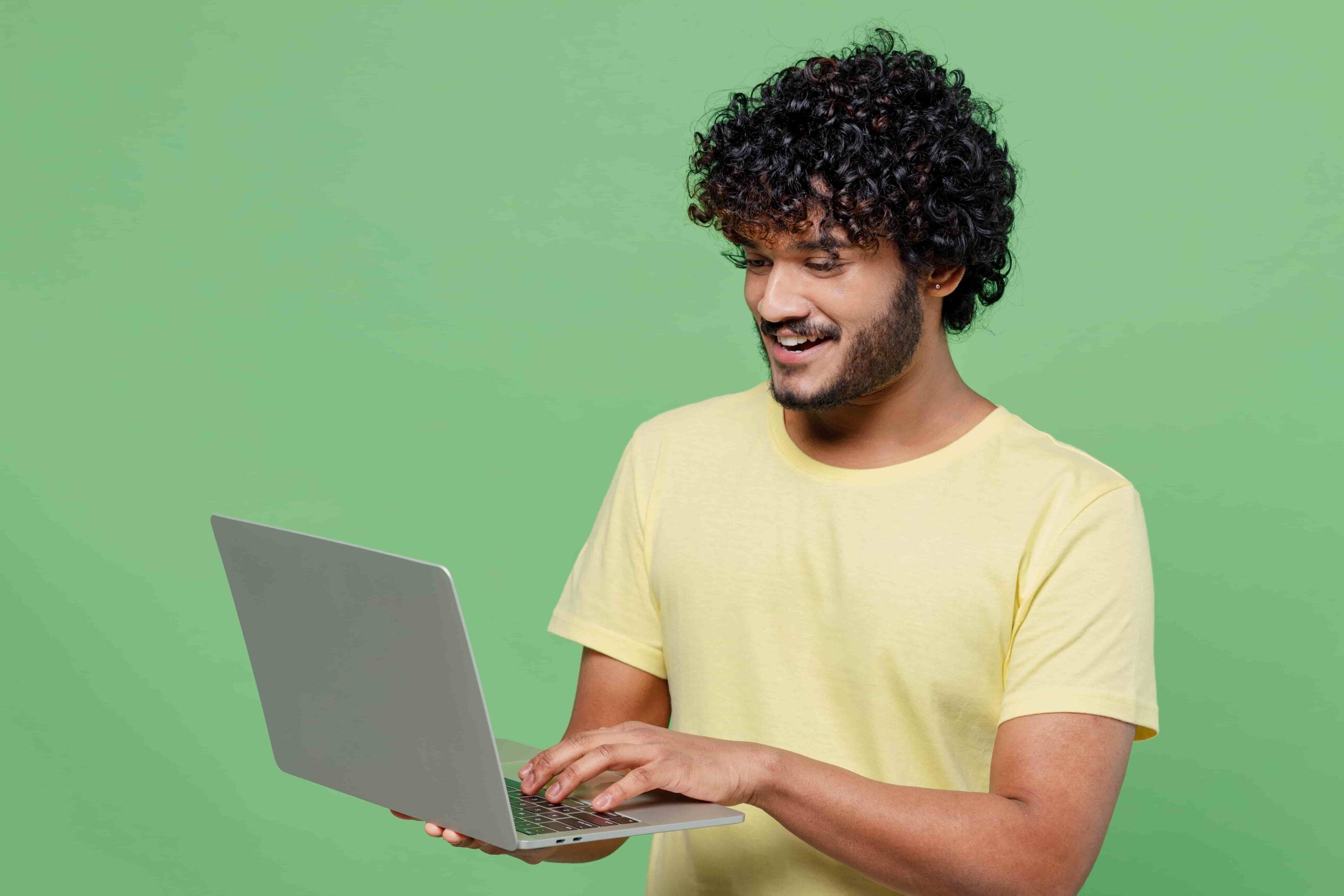 Man working at home using laptop near the big window. Remote work, online  job, work from home. Stock Photo