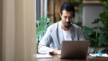 Man working using VoIP