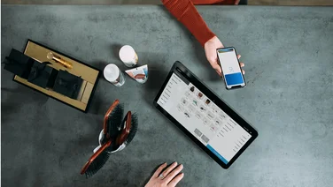 a top down view of a customer making a mobile payment using a modern point of sale system