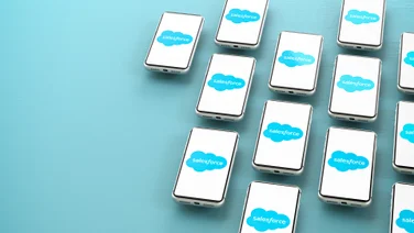 The Salesforce logo on a collection of phones.