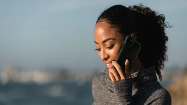 A woman calls on a smartphone