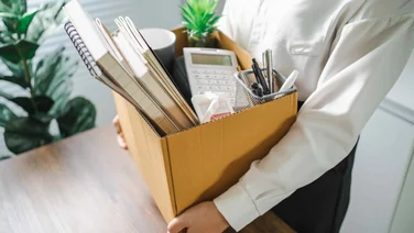 Man packing up belongings from office