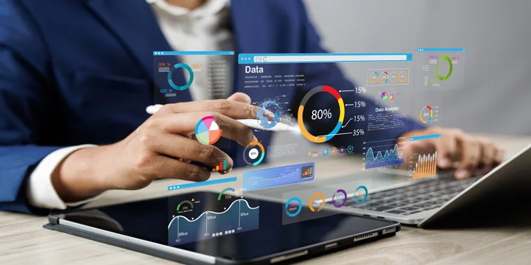 A man uses CRM software on his laptop.