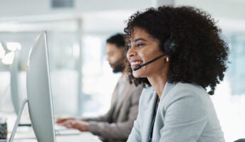 Salesperson sitting in an office on the phone