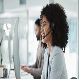 Salesperson sitting in an office on the phone