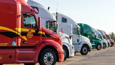 Semi-trucks, parked in a row