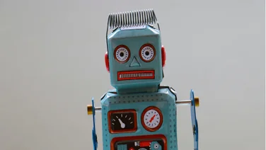 A confused looking robot against a neutral background