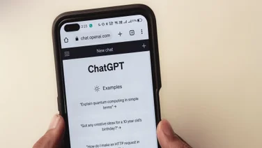 Phone showing someone using ChatGPT