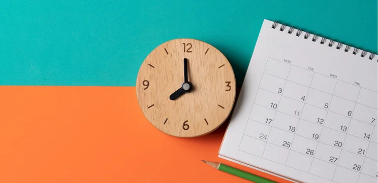 Clock and calendar on colorful background