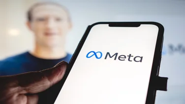 Meta phone screen and Mark Zuckerberg