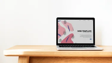 Laptop with web design template on screen