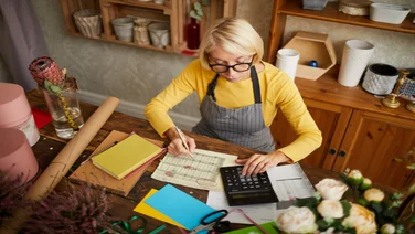 Woman business owner calculating finances