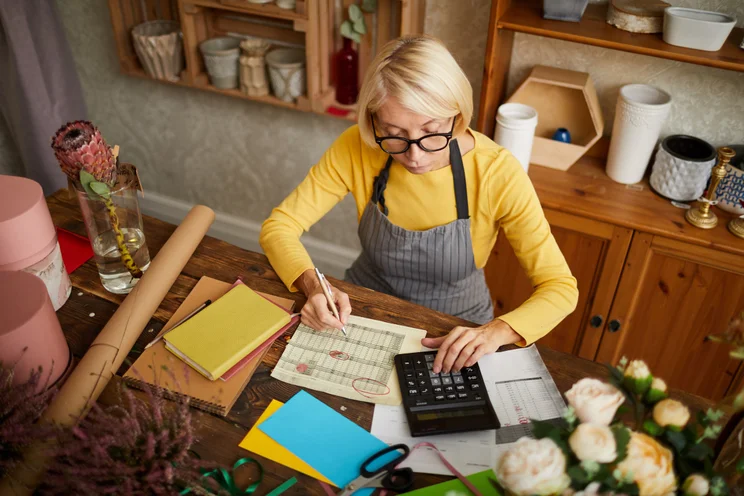 Woman business owner calculating finances
