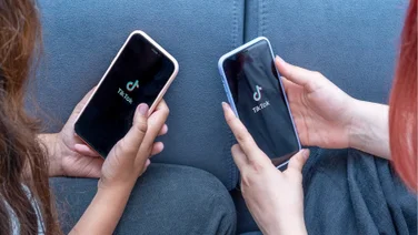 two people using tiktok on phones