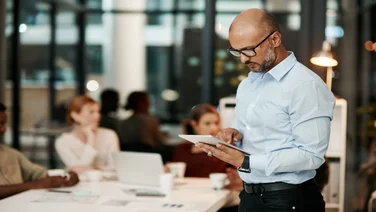 Man on tablet in office