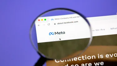 meta on webpage behind magnifying glass