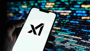 xAI logo on phone screen