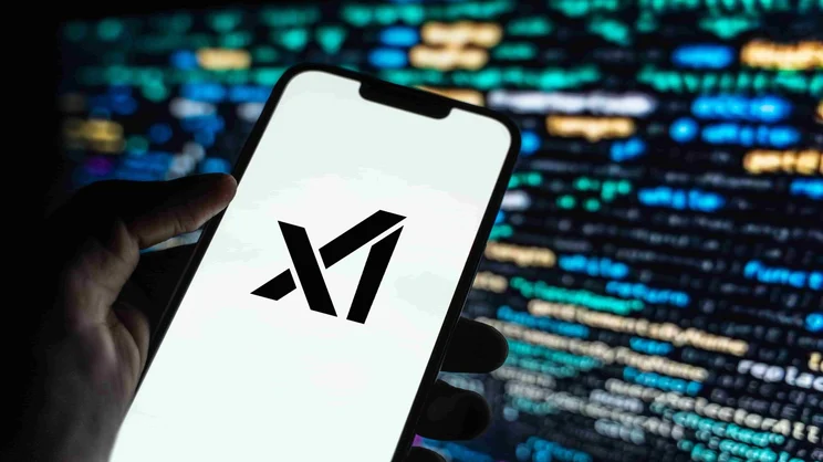 xAI logo on phone screen