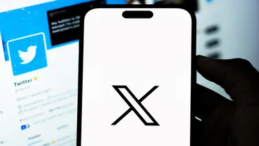 X logo on phone screen