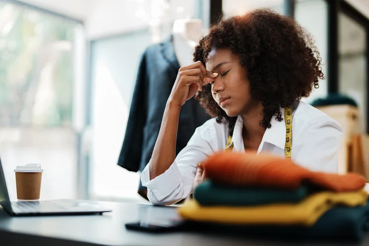 Retail worker looking tired