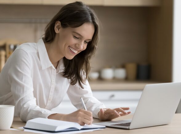 Woman sat at desk with laptop
