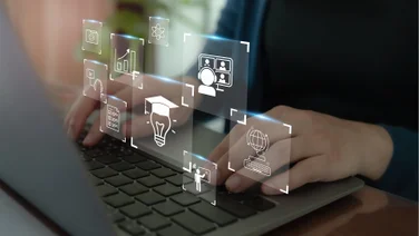 person using keyboard with graphic icons