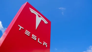 Tesla logo on red sign