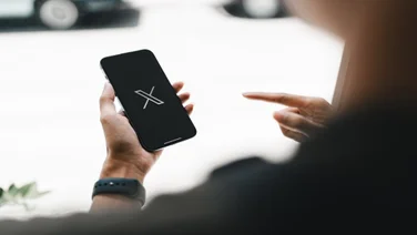 X logo on smart phone