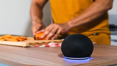 Alexa AI in a kitchen with someone cooking